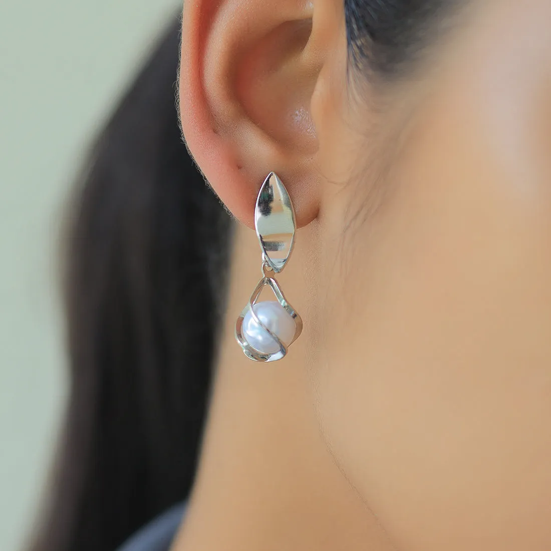 Chic Silver-Toned Earrings With Lustrous Pearl Drops.