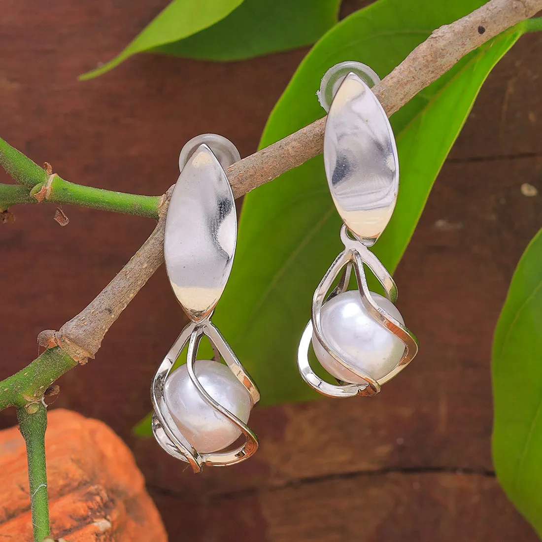 Chic Silver-Toned Earrings With Lustrous Pearl Drops.